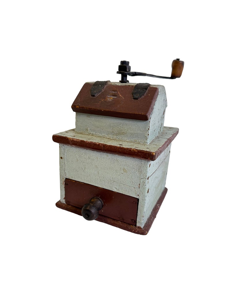 Stunning 19th century coffee grinder, with lovely old paint.

This antique coffee grinder has a hand forged handle and grinder.