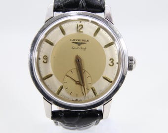 Vintage Longines Sport Chief armbandsur | Manuell uppdragen, schweizisk tillverkning | Stålboett 35 mm | Krämfärgad urtavla | Små sekundvisare