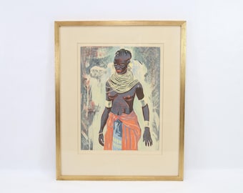 May include: Framed artwork featuring a stylized depiction of a person adorned with jewelry and wrapped in a colorful cloth. The artwork is set against a textured background and framed in a gold-colored frame.
