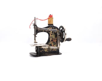 Antique Miniature Hand Crank Sewing Machine Child Model German Pressed Steel Floral Decor ca 1900