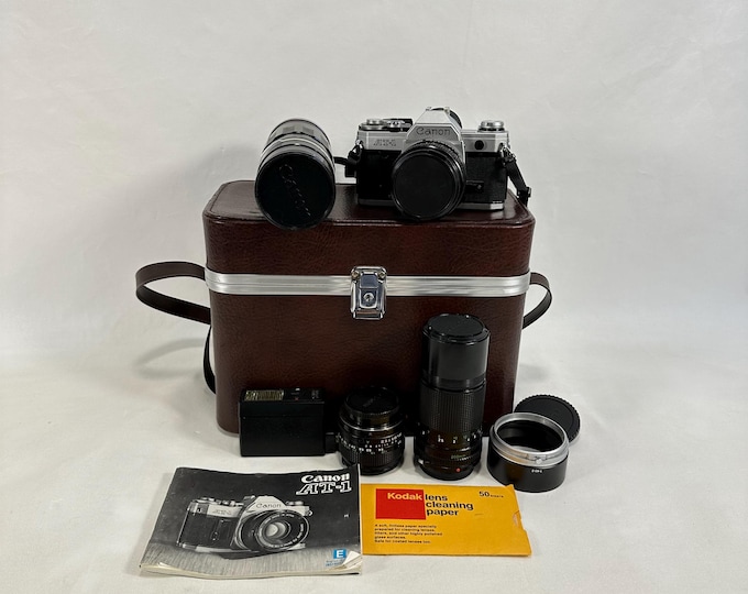 Vintage Canon AT-1 35mm SLR Camera Set with 4 Lenses and Flash - Perfect Gift for Camera Enthusiasts