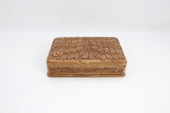 A genuine 1960s Kashmiri carved wooden secret lock box — actual vintage provenance and intricate hand-inlaid craftsmanship you simply can't replicate today.