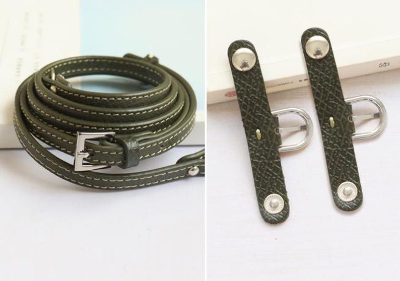 May include: A green leather strap with a silver buckle and two matching green leather strap adjusters with silver buckles.
