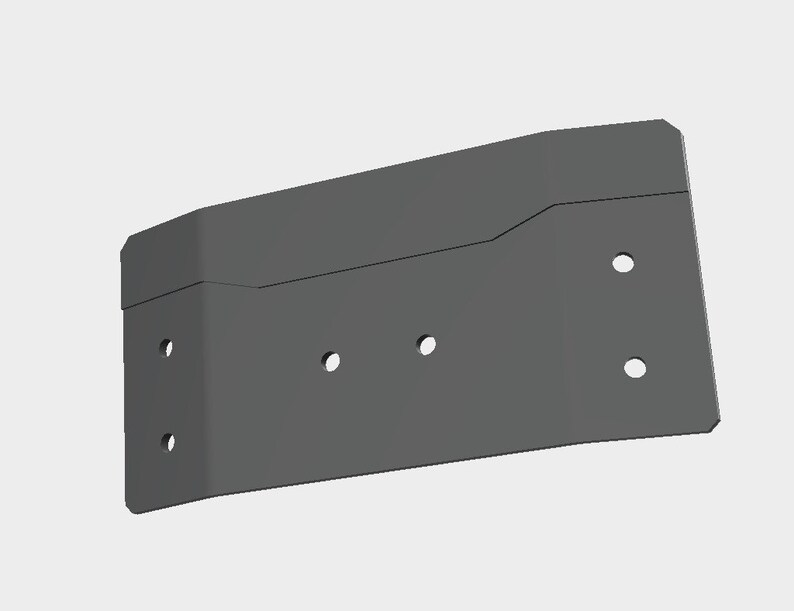 May include: A gray metal bracket with a rectangular shape and rounded corners. The bracket has several evenly spaced holes for mounting. The design includes a subtle curve along the top edge.