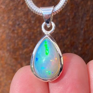 Natural Ethiopian Welo Opal pendant in 925 sterling silver - handmade 12x27mm pendant - multi coloured gemstone