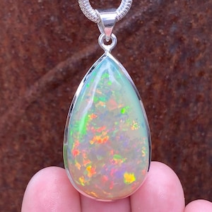 SOLD - RESERVED for A Large natural Ethiopian Welo Opal pendant in 925 sterling silver - 26.6 carat gem - handmade 24x47mm statement pendant
