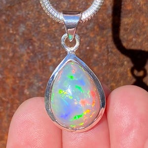 SOLD - RESERVED for A Natural Ethiopian Welo Opal pendant in 925 sterling silver - 7.59 carat gemstone - handmade 15x31mm pendant