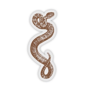 May include: A brown rattlesnake sticker featuring a detailed illustration of the snake coiled in a classic S shape.
