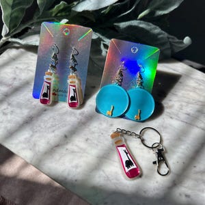 Kuzco Poison Bottle Dangle Earrings - Etsy