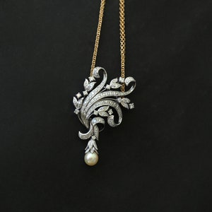 White Gold Pendant, filled with Diamonds and a Pearl + Gold Necklace