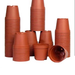 May include: A stack of brown plastic plant pots, some are stacked and some are laying flat. The pots are all the same size and shape.