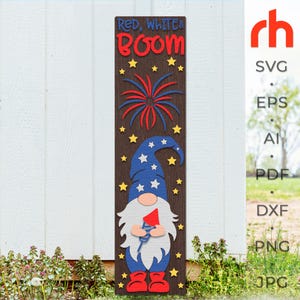 May include: Wooden sign with the text "Red, White & Boom" and a gnome design. The gnome wears a blue hat with white stars and holds a red firework. The sign has a brown background with yellow stars and red, white, and blue fireworks.