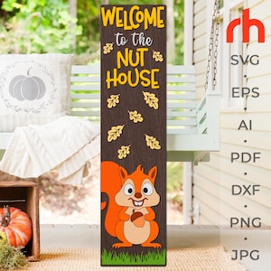 May include: Welcome to the Nut House sign with a cartoon squirrel holding an acorn. The sign is brown with yellow leaves and green grass at the bottom.