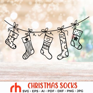 May include: Black and white line art of five Christmas stockings hanging from a string. Each stocking has a unique design, including stars, stripes, and polka dots. The text "CHRISTMAS SOCKS" is displayed in red at the bottom.