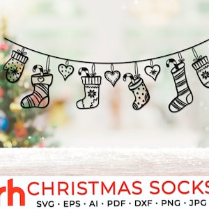 May include: A banner of black Christmas-themed cutouts, including mittens, stockings, and hearts, hangs against a blurred background with a Christmas tree. The text "CHRISTMAS SOCKS" is displayed below the banner.