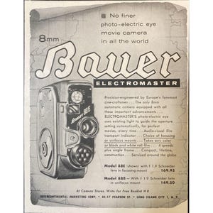May include: A black and silver 8mm movie camera with the brand name "Bauer" and the model name "Electromaster" printed on it. The camera has a photo-electric eye and a lens with a focusing mount. The ad text mentions that the camera is precision-engineered by Europe's foremost cine-craftsmen and is equipped with all the important advancements. The ad also mentions that the camera uses existing light to guide the aperture setting automatically for perfect movies, every time.