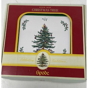 May include: A boxed set of Christmas Tree themed coasters by Spode. The coasters feature a decorated Christmas tree design with ornaments and gifts. The box is red and green with the words "Christmas Tree" and "Since 1938".