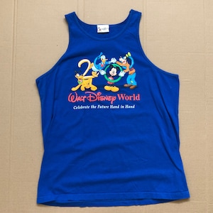 May include: A blue tank top with a graphic of Mickey Mouse, Donald Duck, Goofy, and Pluto. The text "Walt Disney World" and "Celebrate the Future Hand in Hand" is printed on the shirt.