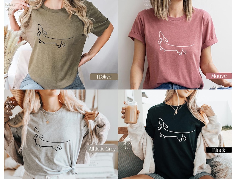 May include: Four different color t-shirts featuring a simple line drawing of a dachshund. The colors are olive, mauve, athletic grey, and black.
