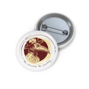 May include: A white button with a black and white illustration of a plague doctor wearing a mask and hat. The text "No vaccine, No poutine" is written below the illustration.