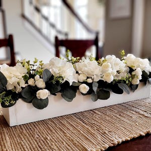 White arrangement in long wood box farmhouse decor hydrangea arrangement dining table decor new home kitchen table arrangement mantle decor