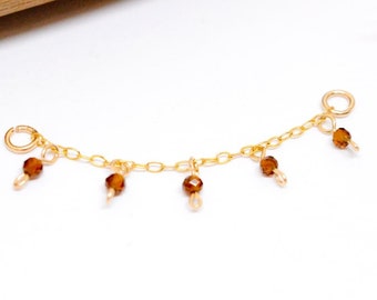 Gold-filled piercing chain with faceted glass beads. For rings, barbells, or hoops. Nose, Nostril, Conch, Helix, Industrial, Upper lobe
