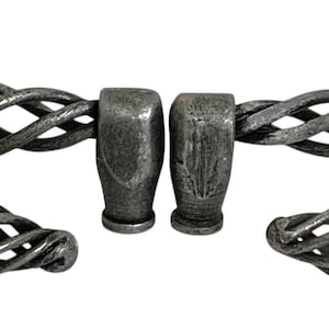 May include: A set of antique-style cabinet hardware, including two long pulls and two smaller knobs. The hardware is made of a dark, weathered metal with a woven cage design. The pulls are approximately 6 inches long.