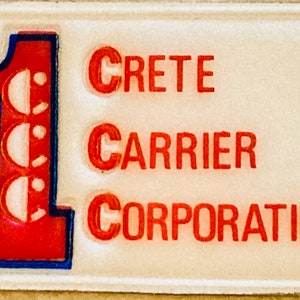 May include: A red and blue patch with the number "1" and the text "CRETE CARRIER CORPORATION".