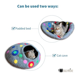 May include: A gray felt cat bed with colorful polka dots. The bed can be used as a padded bed or a cat cave. A cat is laying in the bed in one image and in the cave in the other image.