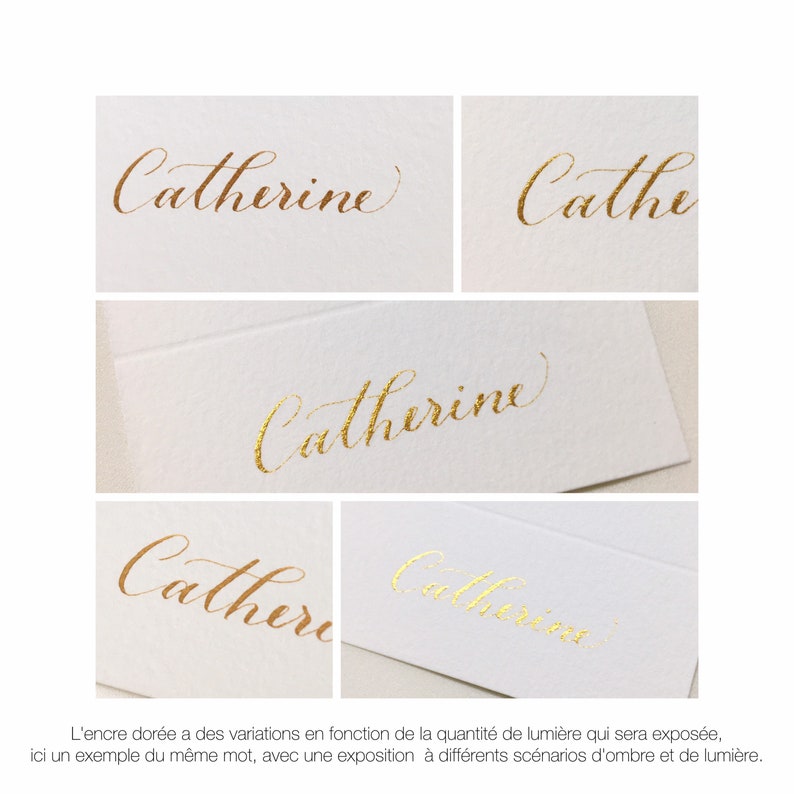 May include: Close-up of the name "Catherine" written in gold calligraphy on a white card. The image shows how the ink appears differently depending on the amount of light it is exposed to.