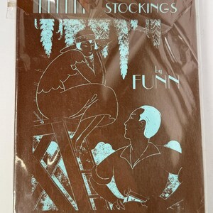 May include: A brown and blue illustration of a woman in a hat standing on a ladder and a man looking up at her. The text "COTTON STOCKINGS by FUNN" is printed on the brown background.