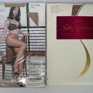 May include: A pack of sheer control top tights with reinforced toe. The pack is white with a gold and burgundy logo that says "Silky Sheer Control Top Reinforced Toe Style 718 Size CD Little Color" and "Aimee Silk Reflections Sheer Collection".