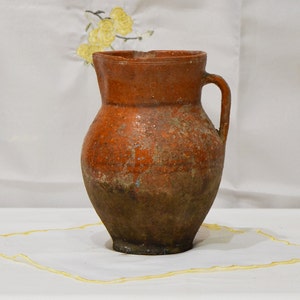 Old clay vase. Wabi sabi decor