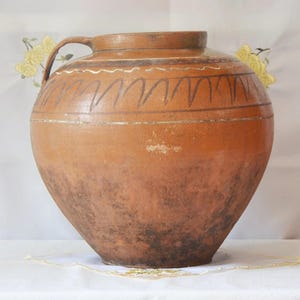 Wabi sabi pottery antique pitcher. Antique terracotta plant pot. Brown primitive clay vessel.