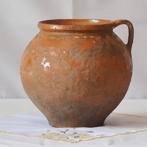 Antique clay bowl. Old brown pottery vase. Wabi sabi pottery primitive vessel.