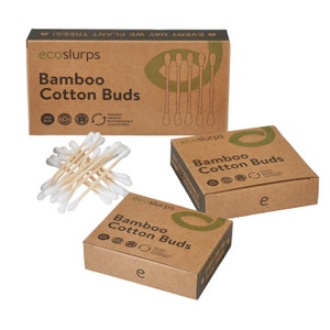 May include: Three boxes of bamboo cotton buds, each with the brand name "ecoslurps" printed on the front. The boxes are made of brown cardboard and have a green leaf logo. The text on the boxes reads "Bamboo Cotton Buds". A pile of bamboo cotton buds is in the center of the image.