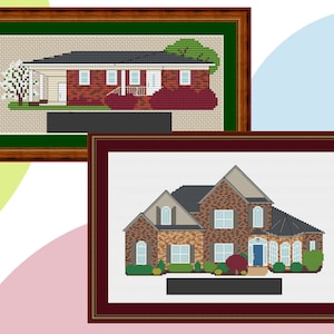 May include: Two framed cross-stitch images of houses. The top image shows a single-storey brick house with a green roof and a white tree in the front garden. The bottom image shows a two-storey brick house with a brown roof and a green bush in the front garden.