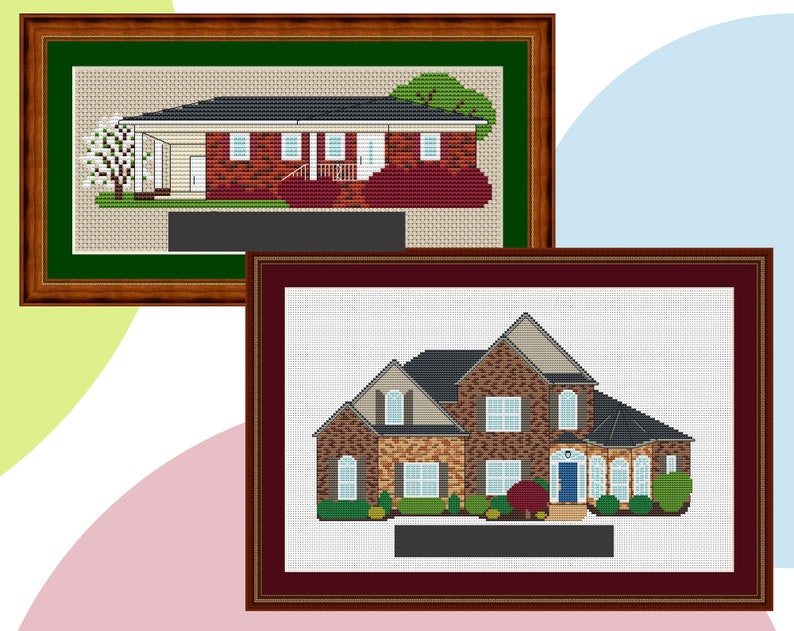 May include: Two framed cross-stitch images of houses. The top image shows a single-storey brick house with a green roof and a white tree in the front garden. The bottom image shows a two-storey brick house with a brown roof and a green bush in the front garden.