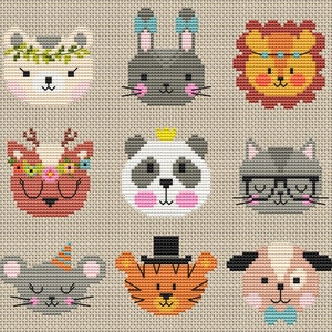 May include: Nine embroidered animal faces with different colors and patterns. The animals include a cat, a deer, a panda, a bunny, a lion, a cat wearing glasses, a mouse, a tiger, and a dog.
