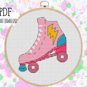 May include: A pink roller skate with a yellow lightning bolt design and blue and red accents. The skate is on a white background.