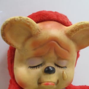 Collectors find 50&#39;s sad face antique figure