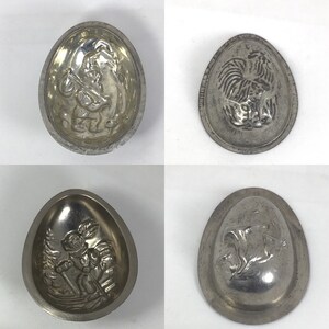 Four vintage metal Easter egg molds