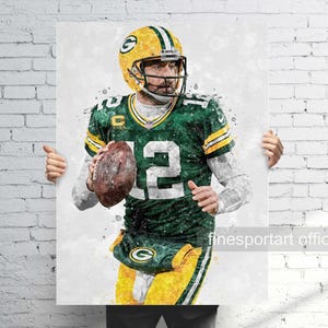 May include: A watercolour-style illustration of a football player wearing a green and yellow uniform with the number 12 on the front. The player is holding a football in his left hand and has a determined expression on his face.