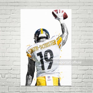 May include: A watercolour illustration of a football player wearing a white and yellow jersey with the number 19 and the name "Smith-Schuster" on the back. The player is raising his right arm in the air, catching a football. The background is white with yellow and black paint splatters.