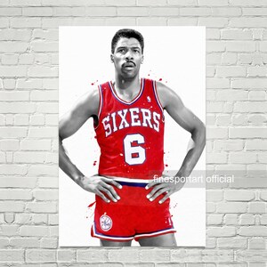 May include: Black and white illustration of a basketball player wearing a red jersey with the word "SIXERS" and the number "6" on the front. The player is standing with their hands on their hips.