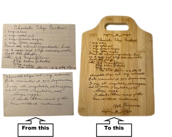 May include: A handwritten chocolate chip cookie recipe is engraved on a light brown wooden cutting board. The recipe includes ingredients like butter, sugar, eggs, and vanilla. The board is labeled "Chocolate Chip Cookies" and signed "Kate Fragernica".