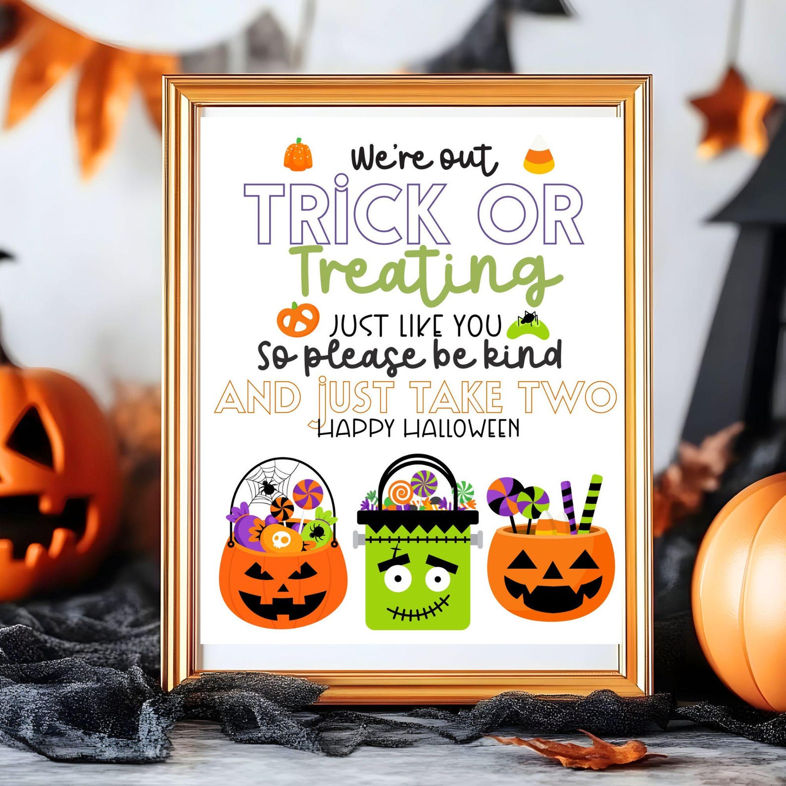 A We’re-Out-Trick-or-Treating Message Framed sign explaining the hosts are out trick-or-treating and asking visitors to take two.