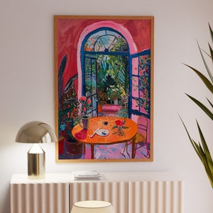 May include: A painting of a room with a large window, a table with a plate and a cup, and a chair. The room is painted in shades of pink and red, and the window is open to a lush green garden.