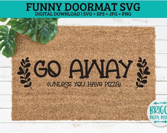 Könnte beinhalten: Eine braune Fußmatte mit dem Text "GO AWAY (UNLESS YOU HAVE PIZZA)" in schwarzen Buchstaben. Der Text ist von zwei schwarzen Blattwerkzweigen umgeben.