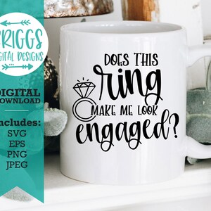 May include: A white ceramic mug with the question "Does this ring make me look engaged?" in black script, alongside a diamond ring graphic. A teal banner on the left side displays "Briggs Digital Designs" and "Digital Download."
